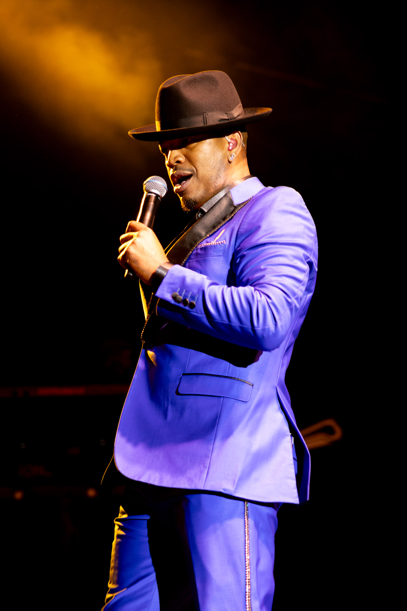 Concert photography of Ne-Yo performing live on stage in Denver