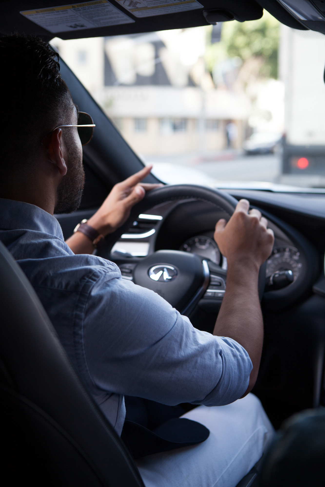 Over-the-shoulder portrait of J Fig (@rule_of_thumbs) driving an Infiniti QX50 through Los Angeles, made for a Crispin Porter + Bogusky campaign.